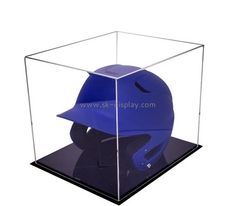 a blue baseball helmet in a clear display case on a white background with clipping for text