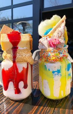 two desserts sitting on top of a wooden table