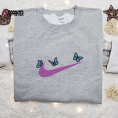 Introducing the Butterfly x Nike Swoosh Embroidered Sweatshirt, a seamless fusion of style and comfort. Crafted with precision, this sweatshirt Nike Embroidered Sweatshirt, Nike Inspired, Sweatshirt Nike, Maroon Hoodie, Embroidered Nike, Nike Swoosh Logo, Take Responsibility, Shirt Embroidery, Swoosh Logo