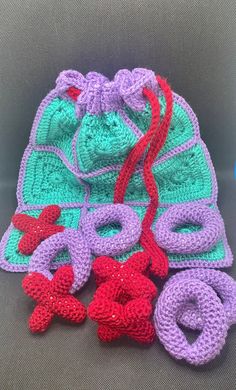 several crocheted items sitting on top of a chair