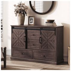 a dresser with drawers and a mirror on the wall above it in a living room