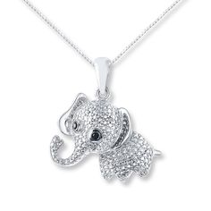 A symbol of happiness and luck, a cute elephant is detailed in sparkling white diamonds with black diamonds for eyes in this whimsical necklace for her. Styled in sterling silver, the pendant suspends from an 18-inch box chain that secures with a lobster clasp. Black diamonds are treated to permanently create the intense black color. Whimsical Necklace, Symbol Of Happiness, Elephant Pictures, Cute Necklaces, Foxes Necklace, Elephant Ring, Elephant Jewelry, Baby Elephants, Contemporary Necklace