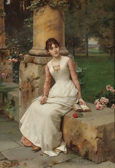 a woman in white dress sitting on a stone wall next to flowers and trees with green grass