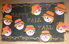 a group of snowmen wearing hats on top of a green sign that says happy fall y'all