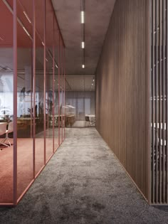 an office hallway with glass partitions and wooden slats on the walls, leading to a meeting room