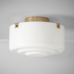 a white ceiling light hanging from the ceiling