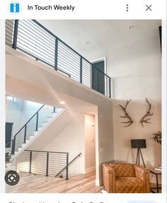 a living room filled with furniture next to a stair case