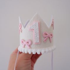 Unleash the cuteness with our 100% handmade  White Pink Bow Birthday Crown, crafted with love for your little one's special day! 🥳🎈  Let the BOW-tiful first birthday celebrations begin! Matching Cake Toppers available as an option. Select in options provided. DETAILS ♕  1 x Felt Birthday Crown with feature pink bows. Finished with mini pom trim and number of choice.   (any number available, not just for 1st Birthdays. Please select number) Elastic comes attached on crown to wear around back of Ballerina First Birthday Party, Fancy One Year Old Birthday Party, Bow Theme Birthday Party, Swan First Birthday Party, Bows Birthday Party Ideas, Bow 1st Birthday Party, Bows First Birthday Party, Bow Themed First Birthday, Diy First Birthday Decorations