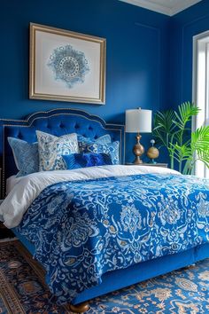 a bedroom with blue walls and an ornate bed in the middle, along with a rug on the floor