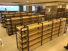 rows of wooden shelves in a large room