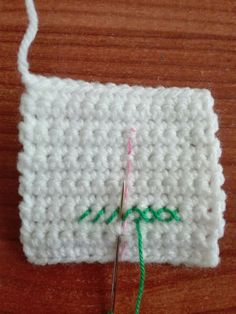 the crochet is being worked on with scissors