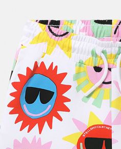 Playful Beach Shorts, Fun White Shorts For Beach, Fun White Beach Shorts, Playful White Shorts For Beach Season, White Cotton Summer Bottoms, White Cotton Bottoms For Warm Weather, Playful Cotton Shorts For Summer, Yellow Summer Cotton Shorts, Fun White Bottoms For Vacation