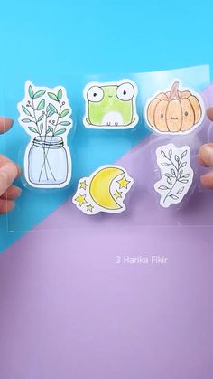 someone is holding up some stickers in front of a purple and blue background with the words 3 harle flikr on it