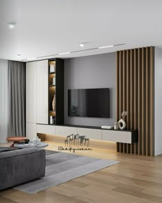 a modern living room with white walls and wood accents, black couches and a large flat screen tv mounted on the wall