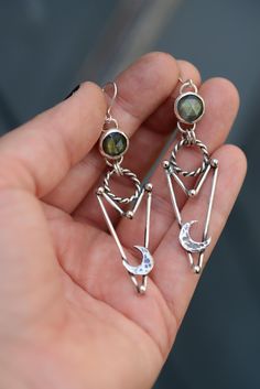 Handmade unique labradorite earrings made in sterling silver. The earrings are approx. 8 cm long (with the hooks) Every jump ring in these earrings are soldered and nothing will fall off. Everything in my shop is handmade by myself in my little studio. I put a lot of time and love into my work and I love to be an artist. If you have some questions please send me a message!! ----------- Handmade Labradorite earrings with texture. The earrings are approximately 8 cm long (measured with the ear hoo Silver Moon Jewelry, Bold Statement Jewelry, Edgy Jewelry, Soldering Jewelry, Witchy Jewelry, Labradorite Earrings, Gemstone Jewelry Handmade, Moon Jewelry, Silver Jewelry Handmade