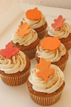 cupcakes with frosting and fall leaves on them