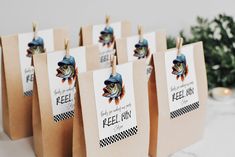 small brown bags with fishing themed tags on them