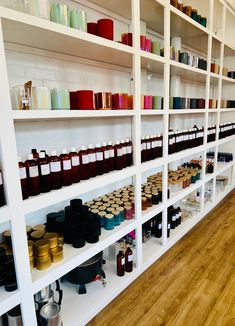 the shelves are filled with many different types of condiments