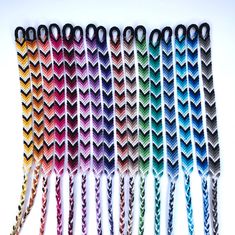 six crocheted hair ties are lined up in rows on a white table top