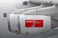 the side of an airplane with swiss air lines on it