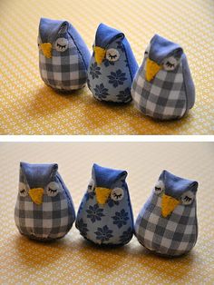 four small stuffed owls sitting next to each other