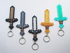 four key chains made out of beads