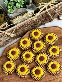 sunflower cookies are arranged on a cutting board