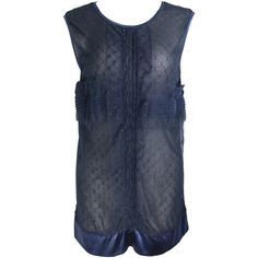 - This beautiful Chanel navy blue lace and silk sleeveless blouse top is a truly collective item. Featuring gathered and puckered front design with satin blue piping trim. See through at the back with silk tie neck closure. A glitter rhinestone "CC" logo on the left front bottom. There is no tag but we think it is a size 40 to 42. - Made in France. Luxury Navy Tops For Women, Luxury Dola Silk Tops, Luxury Navy Top, Luxury Sheer Blue Top, Luxury Modern Navy Tops, Luxury Navy Tops With Button Closure, Luxury Embellished Blue Blouse, Luxury Silk Embroidered Padded Top, Luxury Blue Sleeveless Blouse