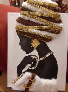 a painting with gold chains on it and a woman's head in the background