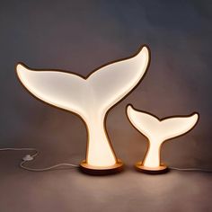 a light that is shaped like a whale tail