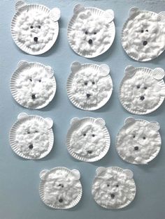 paper plate polar bear craft for toddlers to make with their hands and feet in the shape of snowflakes