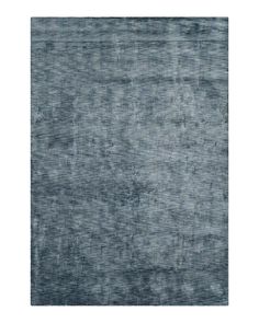 an area rug with dark blue tones