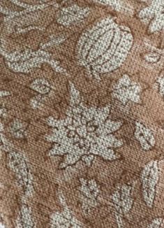 closeup of the fabric with flowers and leaves on it