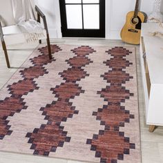 a living room area with a rug and chair