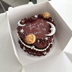 there is a cake in the box with writing on it