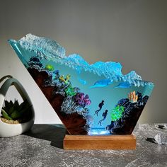 This is a new design that breaks all limits, for those who love manatees, ocean, detail and authenticity.  You will feel so relaxed and free when looking at this epoxy resin lamp. The upper part depicts crashing waves, below is a colorful coral formation with leisurely swimming manatees. The lamp seems to bring a corner of the ocean into your living space Each lamp is meticulously handcrafted with 10 - 12 steps, resulting in no two being the same (there are slight differences in the photos) Addi Best Handmade Gifts, Epoxy Resin Lamp, Ocean Resin, Resin Lamp, Led Fairy Lights, Art Lamp, 12 Steps, Crashing Waves, Rgb Led Lights