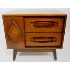 a wooden cabinet with two drawers on one side and an open drawer on the other