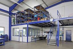 the inside of a building with stairs and tables