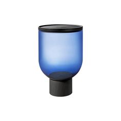 a blue vase sitting on top of a wooden stand