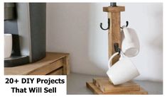 two mugs are hanging on a wooden stand with the words 20 + diy projects that will sell