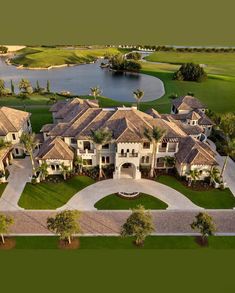 an aerial view of a large home in the middle of a golf course