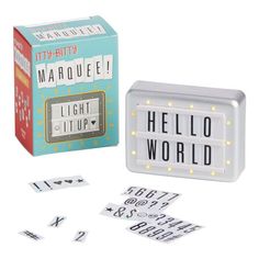 a light up box with letters and numbers on the front, along with stickers that say hello world