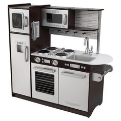 a white and brown toy kitchen with sink, oven, microwave and stove top grill