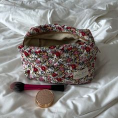 Our Autumn Large Makeup Bag is a stylish and spacious carry-all designed to hold all your essentials with a classic look. The quilted exterior boasts a beautiful floral pattern, complemented by the beige interior crafted from thick and soft terry material. Perfect for organizing your makeup and beauty essentials or serving as a travel organizer (it fits seamlessly inside a suitcase), this bag is a must-have for those who appreciate both organization and style. Size: 10" x 6" x 6" Large Makeup Bag, Beige Interior, Nude Makeup, Travel Organizer, Makeup Bags, Beauty Essentials, Classic Looks, Makeup Bag, Floral Pattern