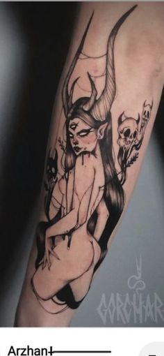 a woman with horns and skulls on her arm is depicted in this tattoo design, which has been done by an artist