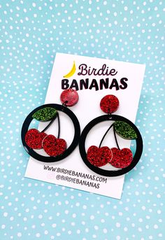 ... Feeling Fruity Cherry Earrings Features  Layered acrylic glitter cherries set against a black hoop background topped with a matching red glitter stud.  Very lightweight and easy to wear Materials: acrylic, surgical steel posts Colours : Black , Red, Green Size Length:  6.5cm Width: 4.5 cm Shipping and Handling I aim to ship same or next business day. Shipping is standard and generally takes 2-14 business days.  If you require an express service please upgrade shipping at checkout. Internatio Glitter Cherries, Rockabilly Earrings, Cherry Earrings, Fruit Earrings, Red Glitter, Red Green, Statement Earrings, Handmade Natural, Favorite Jewelry