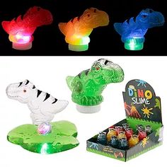 three different types of dinosaur light up toys in their display boxes with the same design