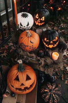 halloween pumpkins with carved faces and jack - o'- lanterns