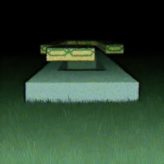 a bench sitting in the middle of a field at night with no one on it