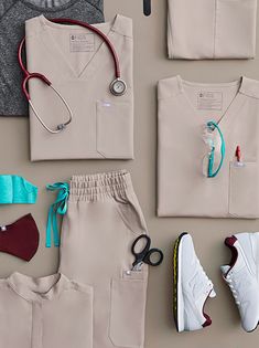 various medical items laid out on the floor next to each other, including shoes and t - shirts